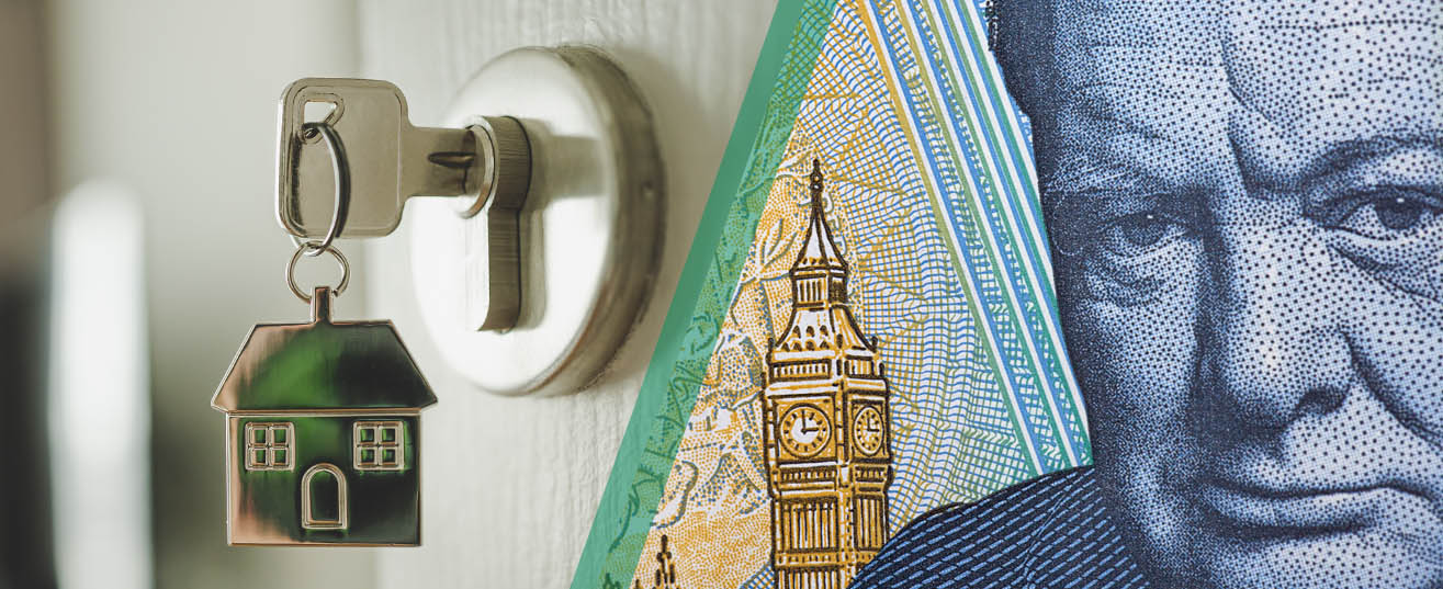 Image composition of a house-shaped keyring hnging on a key in an open door mext to a close-up picture of the detail on a five pound note.